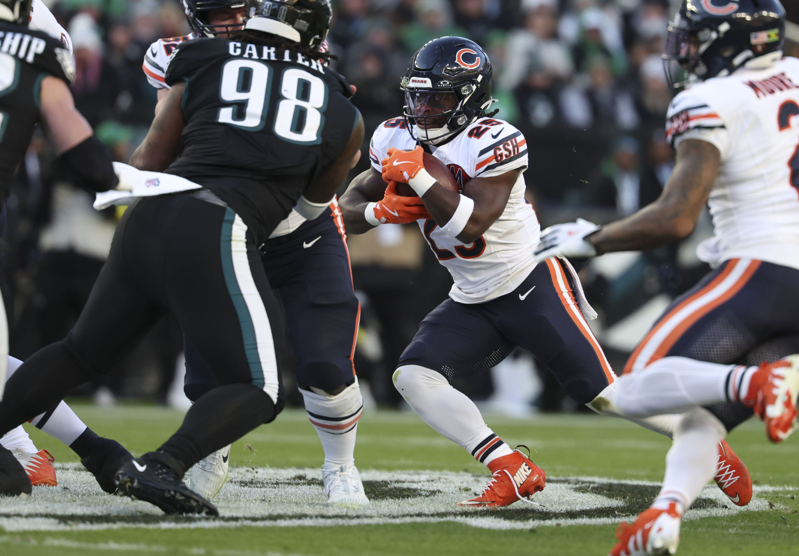 Chicago Bears running back Kyle Monangai (25) runs the ball...