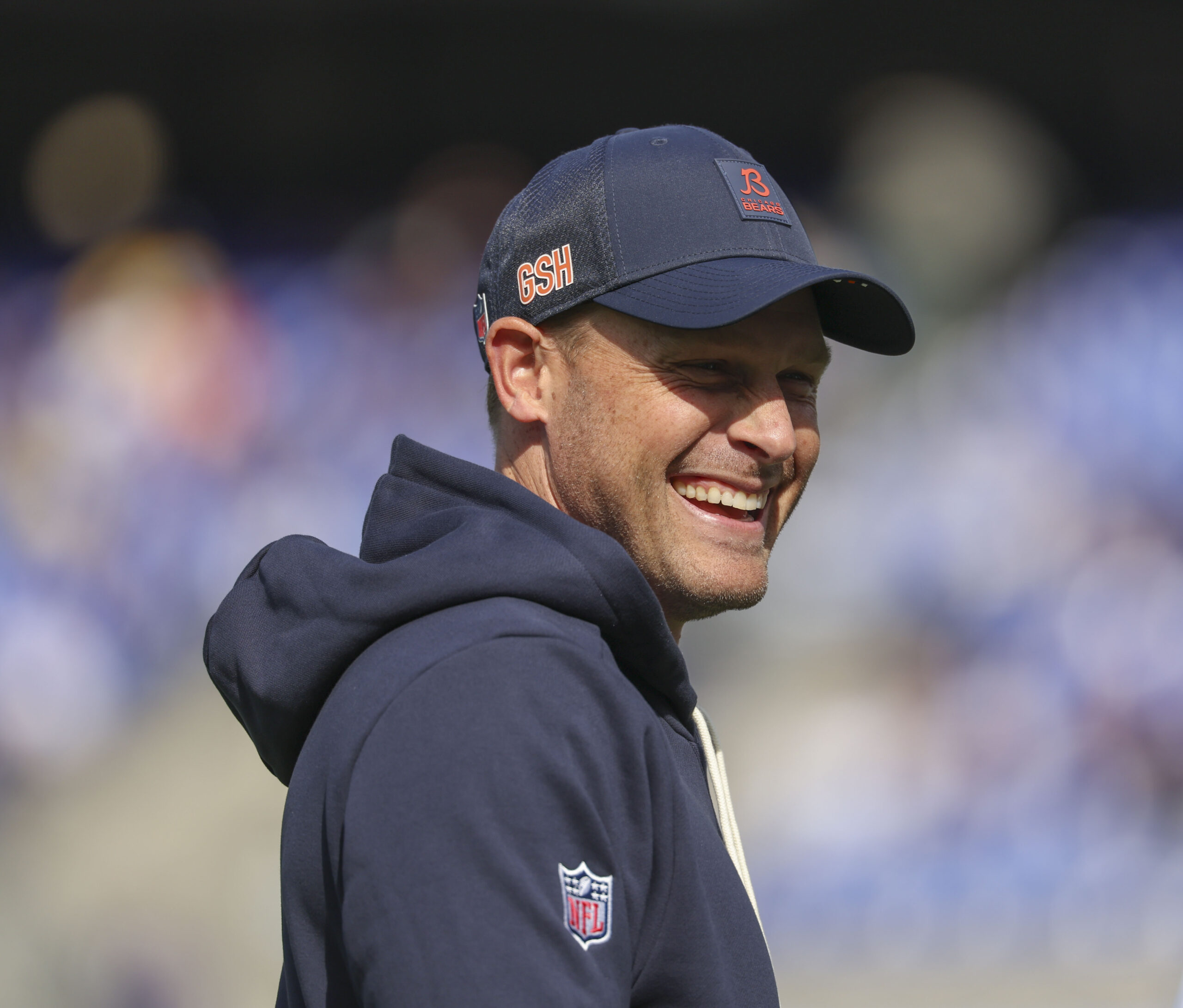 Bears coach Ben Johnson watches his team warm up to...