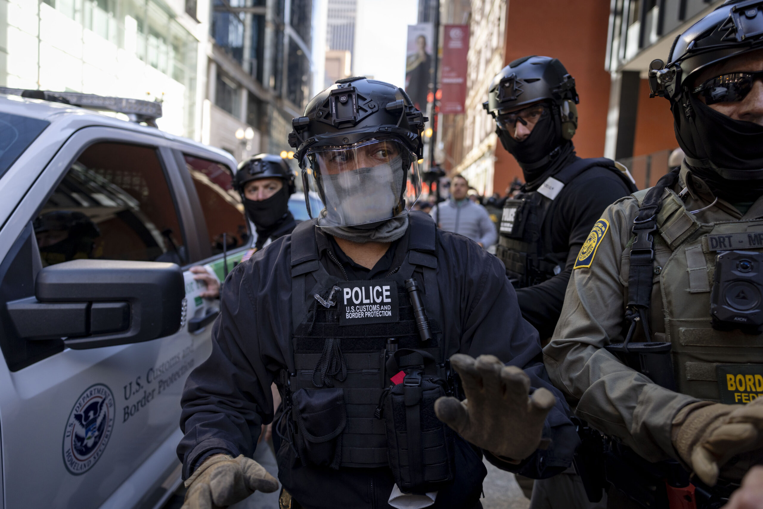 Border Patrol agents escort Cmdr. Gregory Bovino as he leaves...