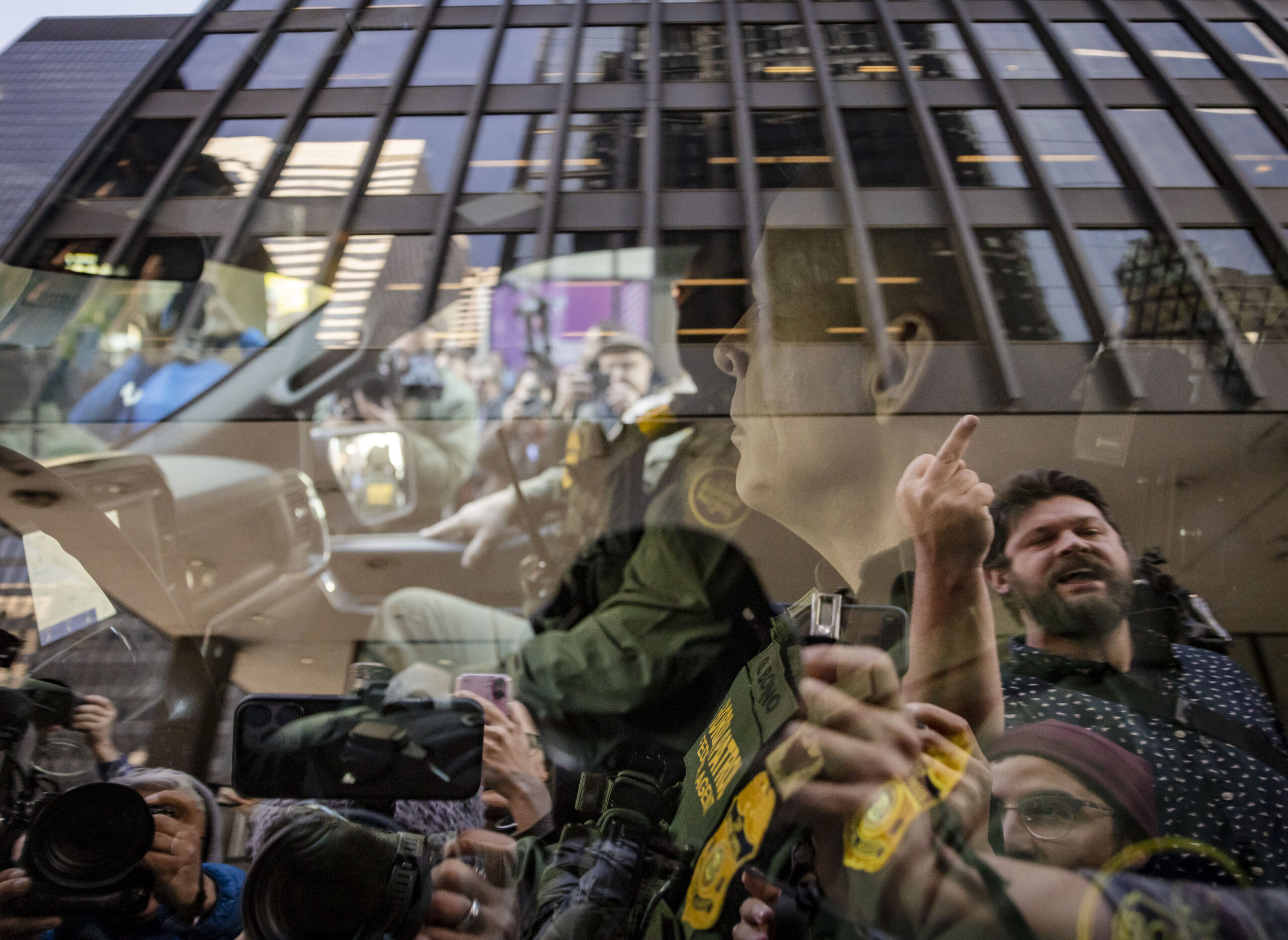 Border Patrol Cmdr. Gregory Bovino leaves the Dirksen U.S. Courthouse...