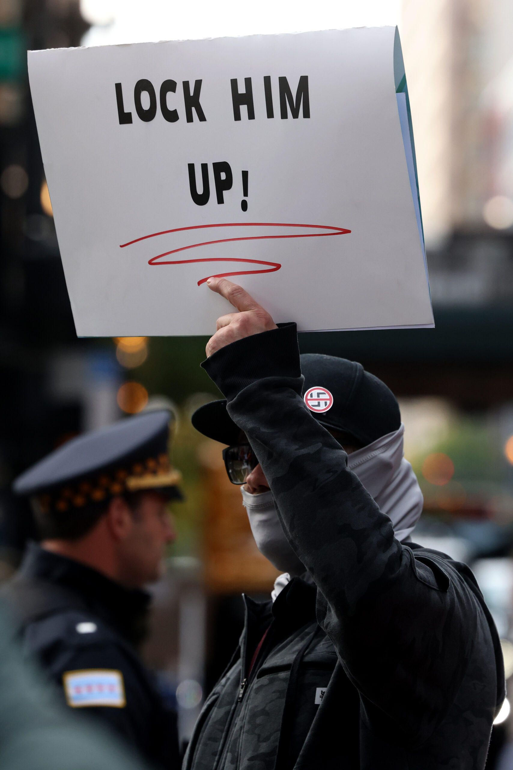 A protester stands outside the Dirksen U.S. Courthouse during Border...