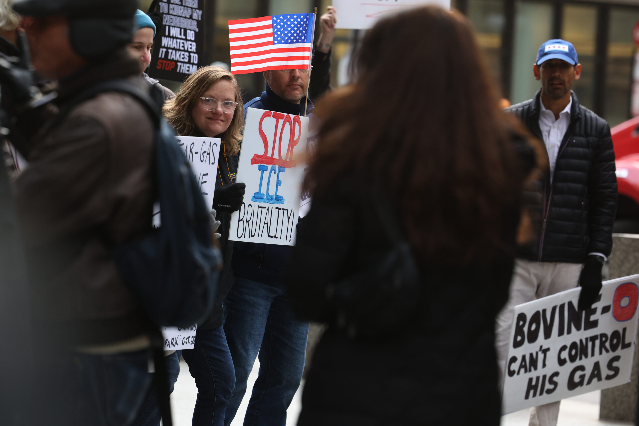 Protesters stand outside the fencing surrounding the Dirksen U.S. Courthouse...