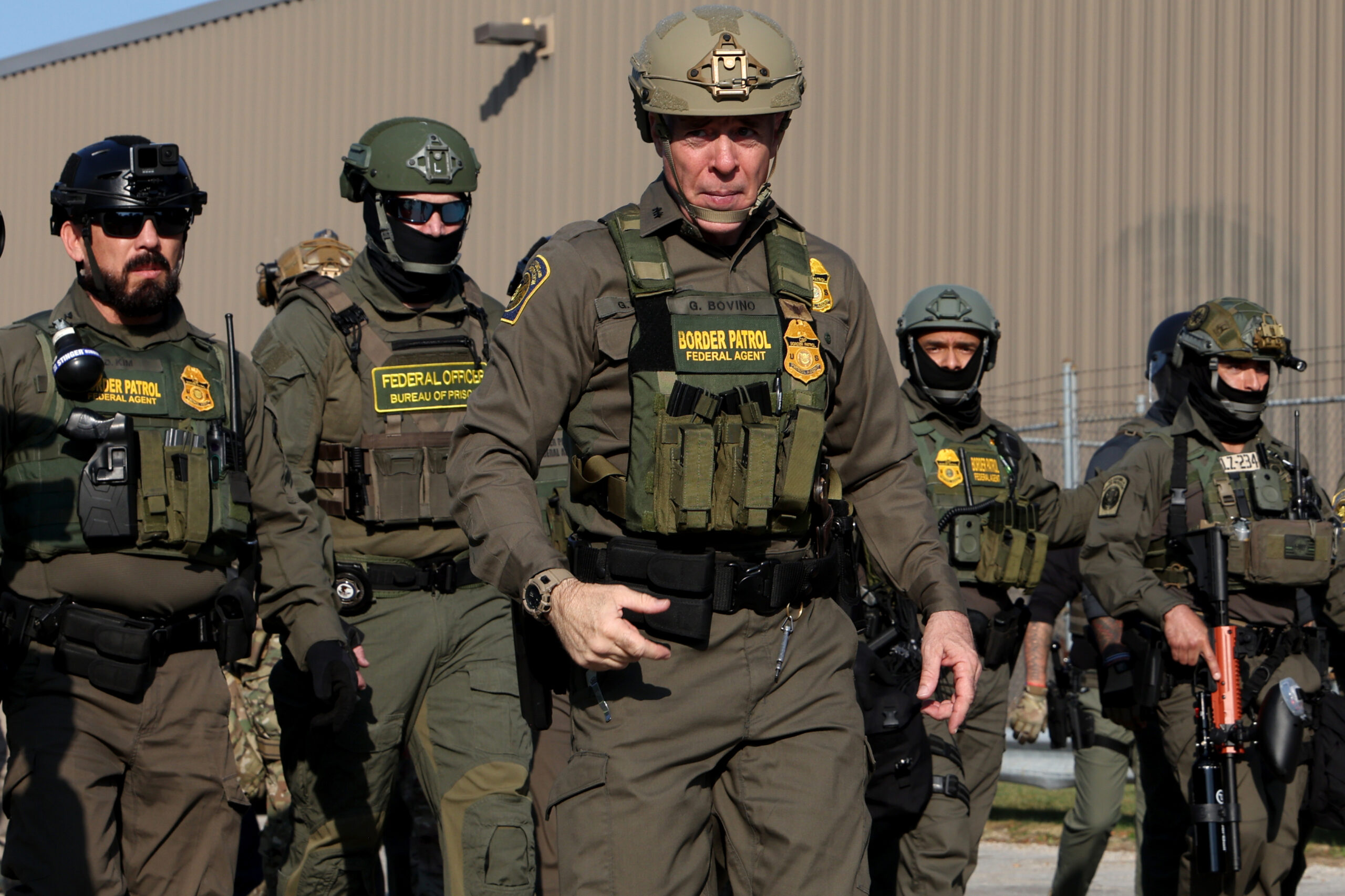 Gregory Bovino, U.S. Border Patrol field boss, center,Â leads several federal...