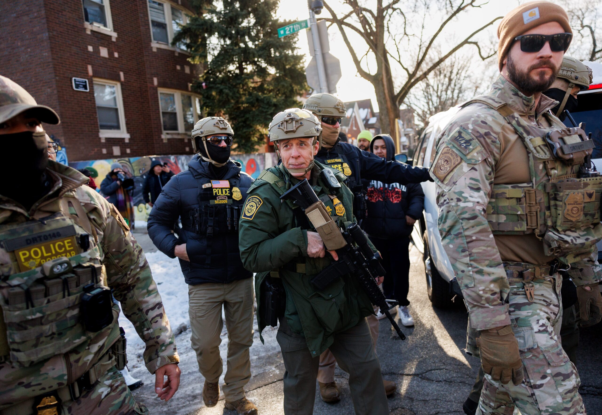 U.S. Border Patrol Cmdr. Gregory Bovino walks with agents after...