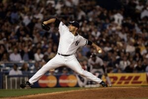 The postseason success of Andy Pettitte, shown here pitching in the last game at the old Yankee Stadium, lands him a spot as one of the greatest Yankees pitchers of all time.