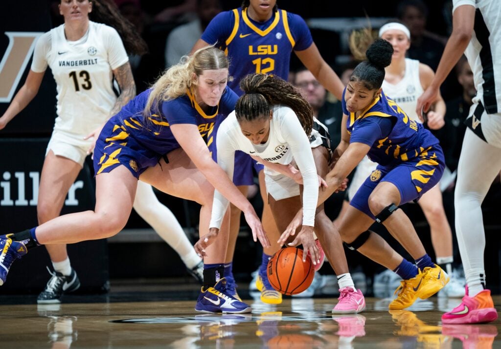 Vanderbilt guard Mikayla Blakes (1) is fouled by Louisiana State forward Kate Koval (13) as guard Jada Richard (30) helps out during their game at Memorial Gymnasium Sunday, Jan. 4, 2026. © Denny Simmons / The Tennessean / USA TODAY NETWORK via Imagn Images
