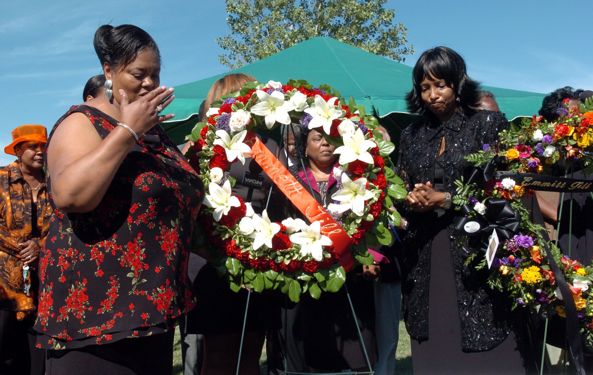 Ollie Gordon, left, of Robbins, blows a kiss for her...