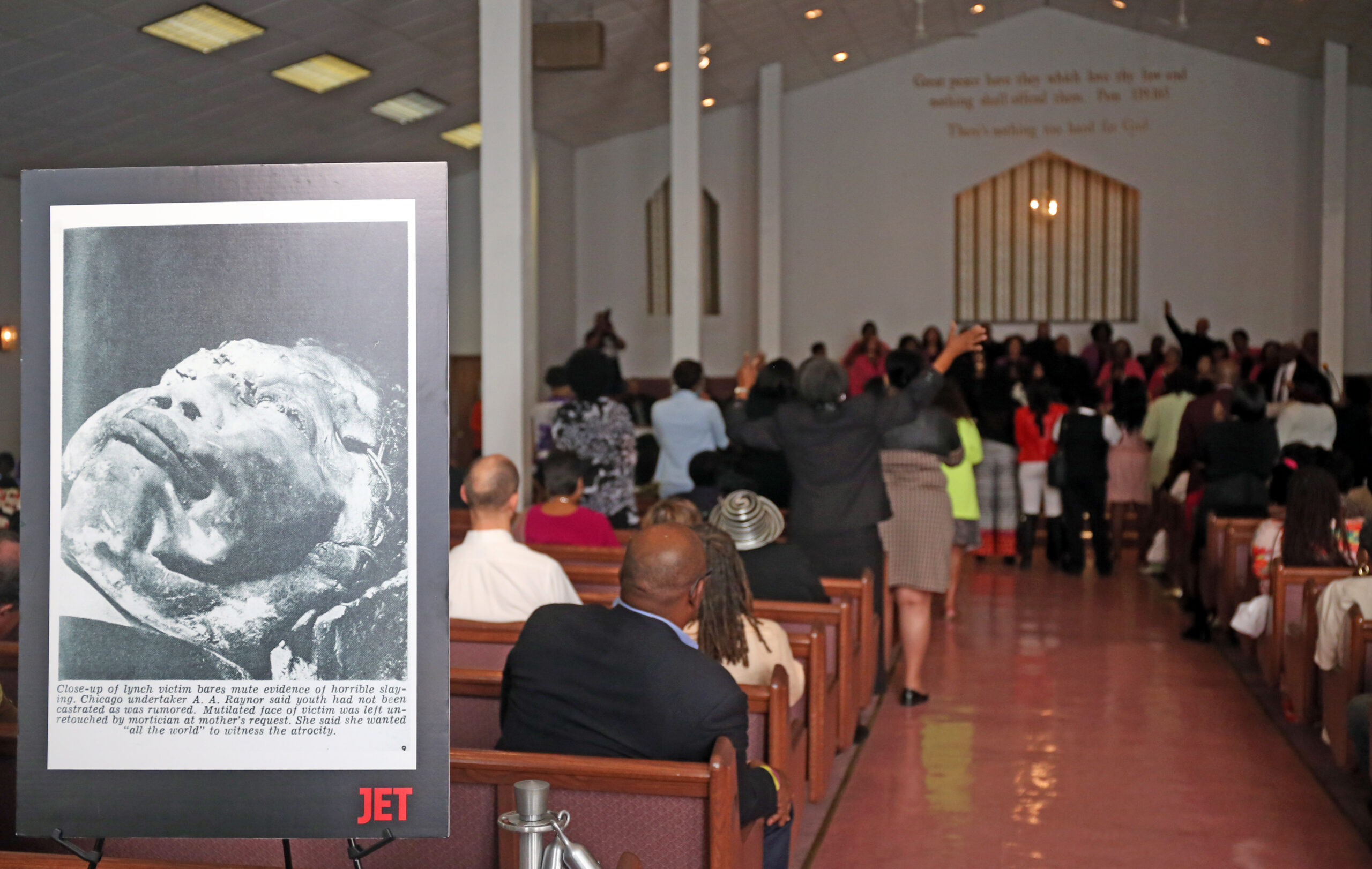 A 1955 photo of Emmett Till's funeral is displayed at...