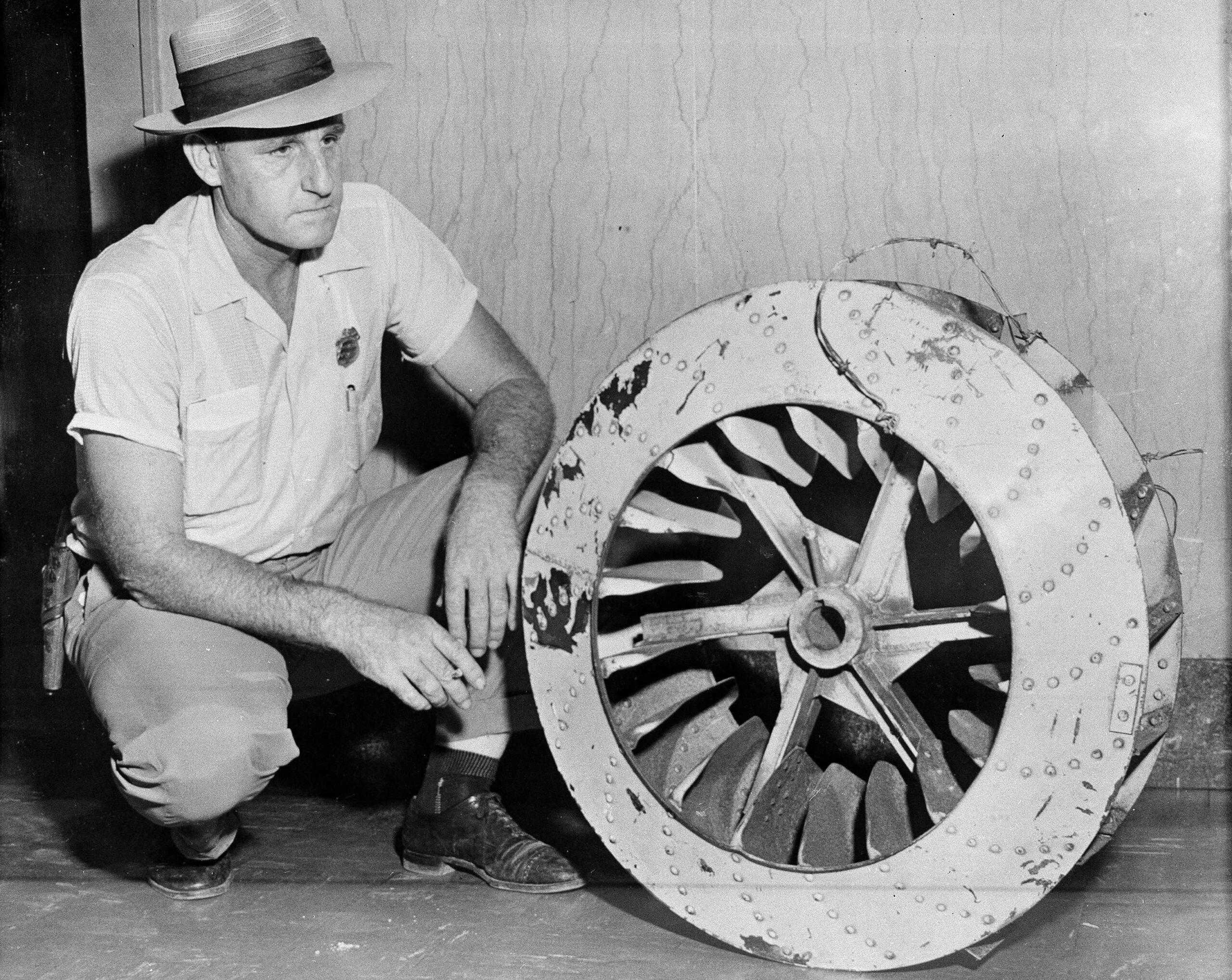 Leflore County Deputy Sheriff John Ed Cothran examines the huge...