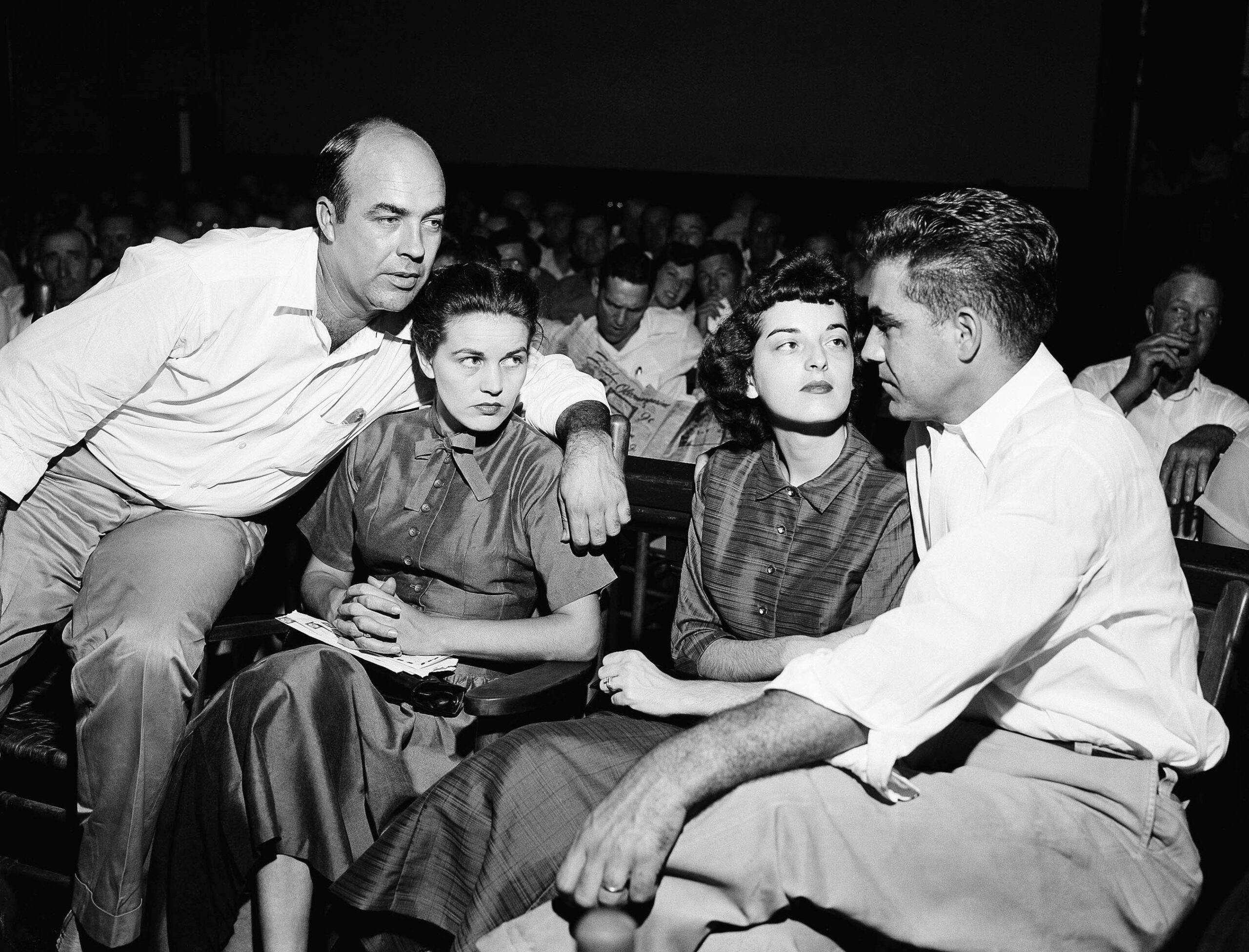 J.W. Milam, left, and Roy Bryant, right, sit with their...